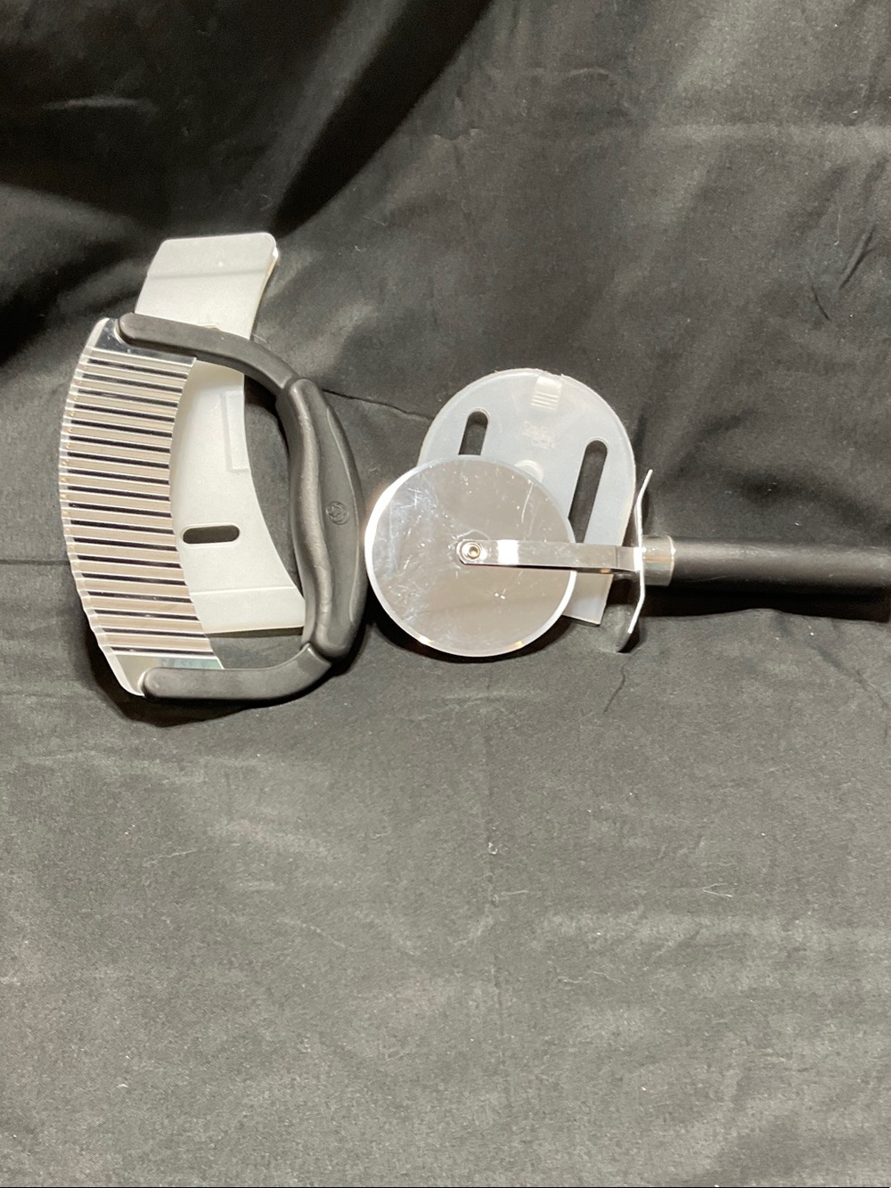 Pampered Chef Crinkle Cutter & Pampered Chef Pizza Cutter.